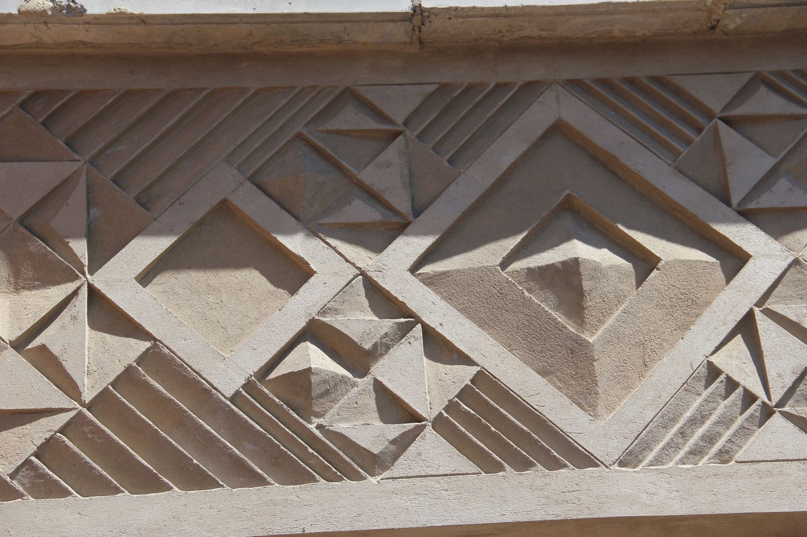 The finished geometric relief frieze