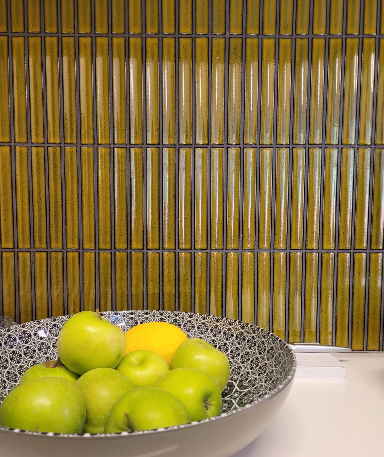 Glazed finger tiles above a quartz worktop