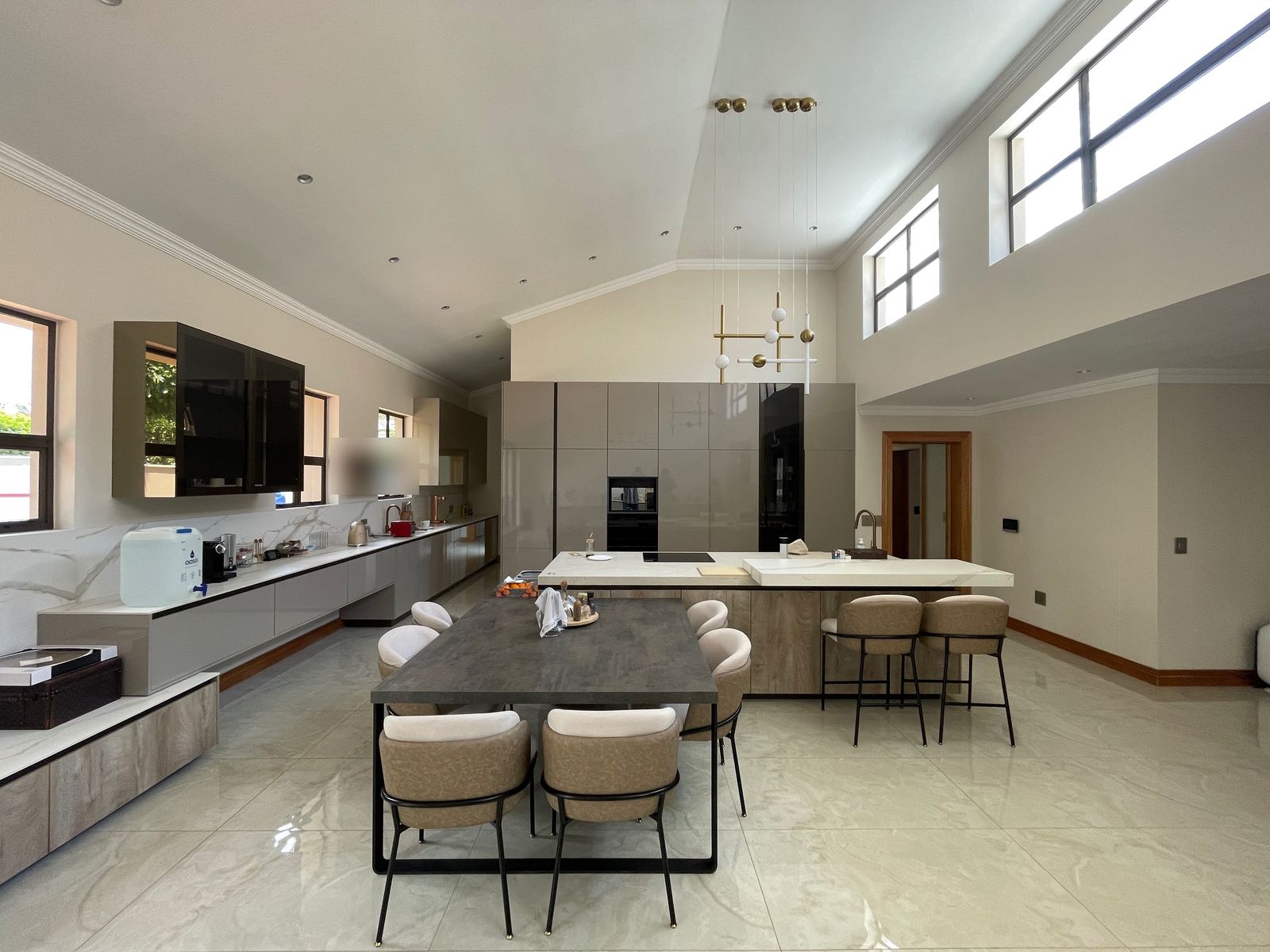 A double-volume family kitchen with clerestory light